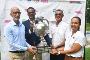 Some of the main stakeholders (from left) Dr. Carey Wallace, executive director of TEF, Allan Beckfor, general manager at SDF, Peter Chin, chairman of the Jamaica Open organizing committee and Jodi Munn-Barrow, president of the JGA, happily hang on to the event trophy at the launch of the open last Thursday at the Constant Spring Golf Club in Kingston.  
