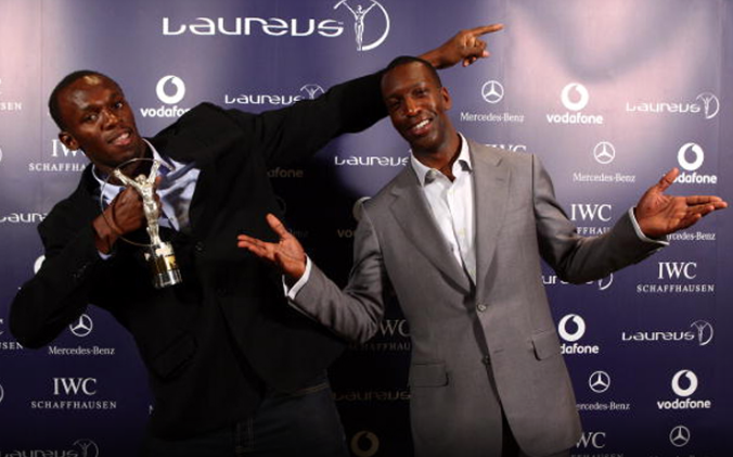 Usain Bolt (JAM) World record holder for 100m and 200m, poses with Academy Member Michael Johnson (R) after receiving the Laureus World Sportsman of the year award during a ceremony and press conference held at The Four Seasons Hotel on June 10, 2009 in Toronto, Ontario. (Photo by John Gichigi/Getty Images for Laureus) *