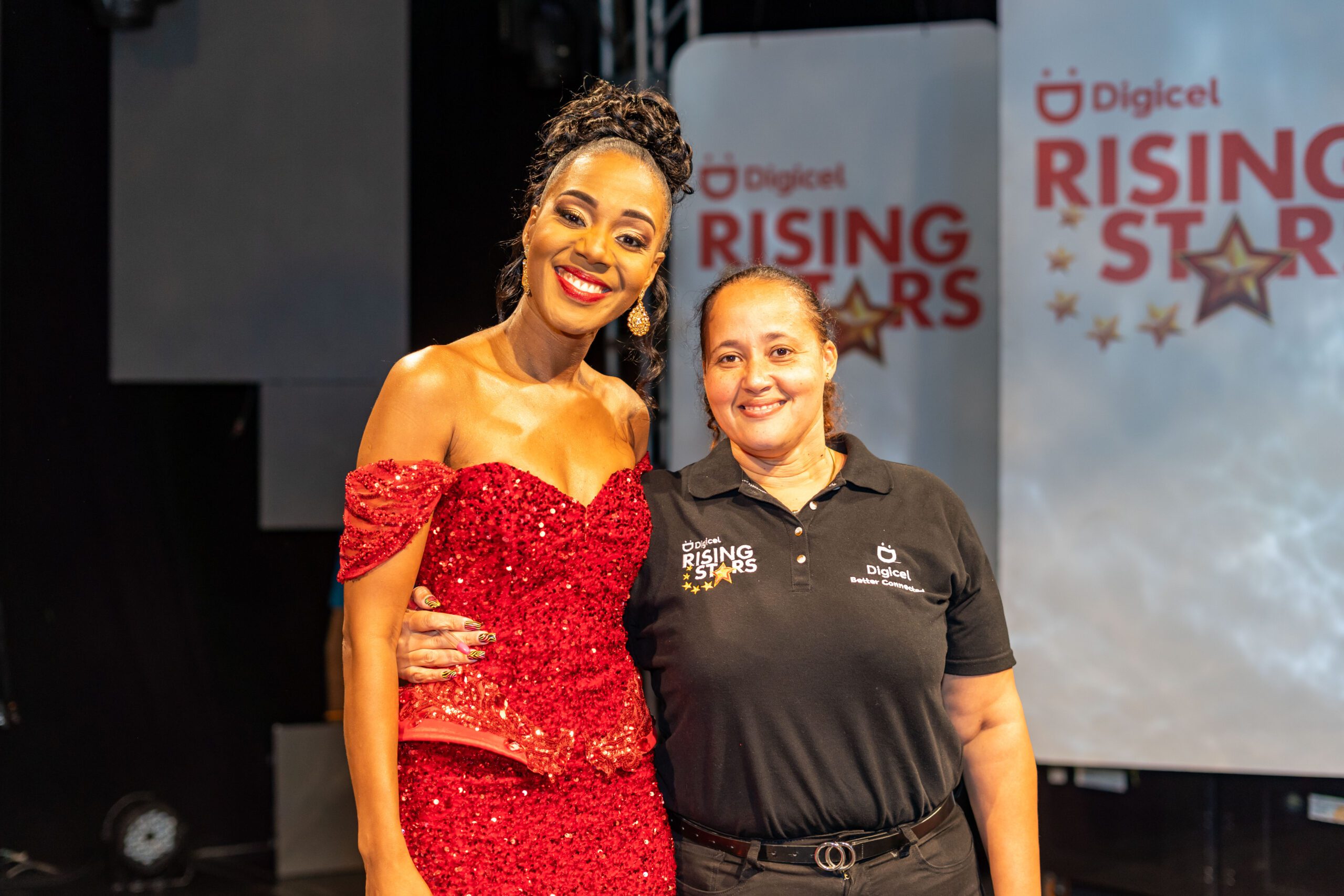 Terri-Karelle takes a photo with her producer Sharon Schroeter after her final show as host of Digicel Rising Stars