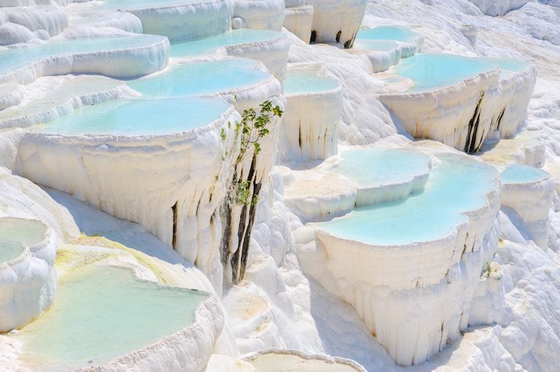 Blue water travertine pools at Pamukkale, Turkey